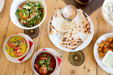 Image showing various food on table of indian restaurant