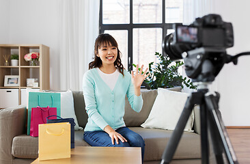 Image showing female blogger making video blog about shopping