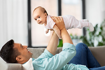 Image showing happy middle aged father with baby at home