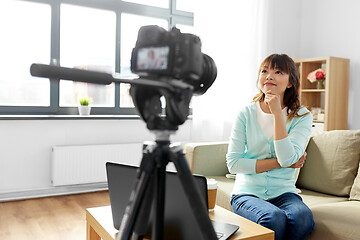 Image showing asian female blogger with camera recording video