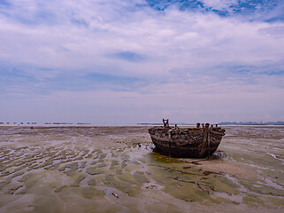 Image showing Old wooden barge at low tide