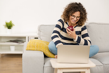 Image showing Beautiful woman working at home