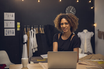 Image showing Fashion designer on her Atelier