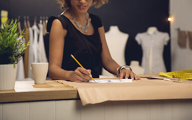 Image showing Fashion designer on her Atelier