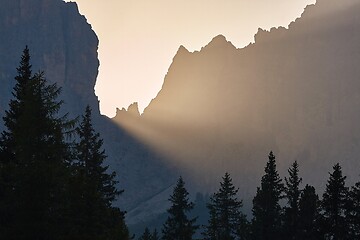 Image showing Sunrise between mountain cliffs