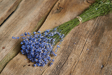 Image showing A bunch of lavender flowers on on stone surface