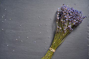 Image showing A bunch of lavender flowers on on stone surface