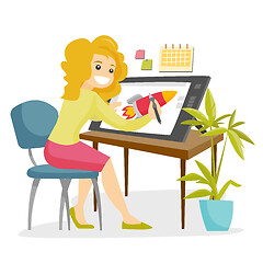 Image showing A white woman graphic designer works at the office desk.