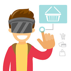 Image showing A white man in virtual reality headset doing online shopping.