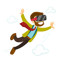 Image showing A white man in virtual reality headset flying in the air.