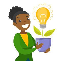 Image showing A businesswoman with a lightbulb as a symbol of business idea.