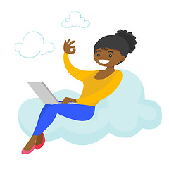 Image showing A woman on a cloud working on a laptop and showing ok sign.