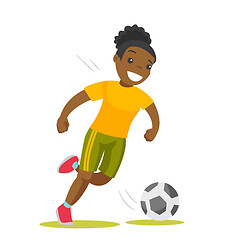 Image showing Black soccer player kicking the ball.