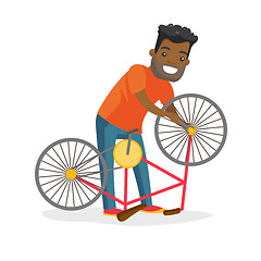 Image showing Black man working in the bike workshop.