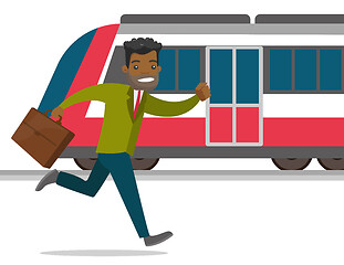 Image showing A man catching a missing train at the train station.