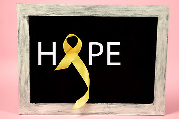 Image showing Yellow ribbon symbolic color for Sarcoma Bone cancer awareness and suicide prevention