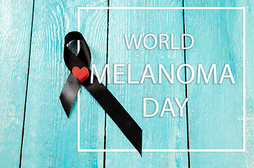 Image showing Black ribbon-symbol of fight against melanoma and skin cancer.