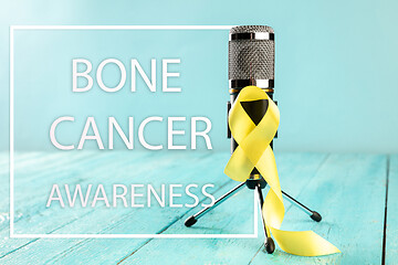 Image showing Yellow ribbon symbolic color for Sarcoma Bone cancer awareness and suicide prevention