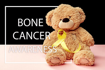Image showing Yellow ribbon symbolic color for Sarcoma Bone cancer awareness and suicide prevention