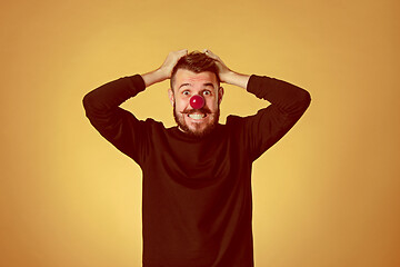 Image showing Happy man on red nose day.