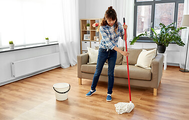 Image showing woman or housewife with mop cleaning floor at home