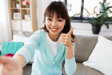 Image showing asian female blogger taking video or selfie