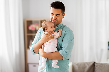 Image showing middle aged father with baby daughter at home