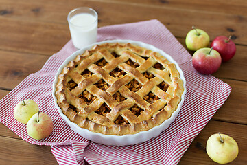 Image showing apple pie in baking mold on wooden table