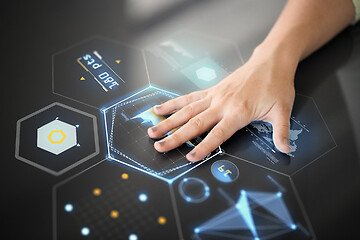 Image showing hand using black interactive panel with charts