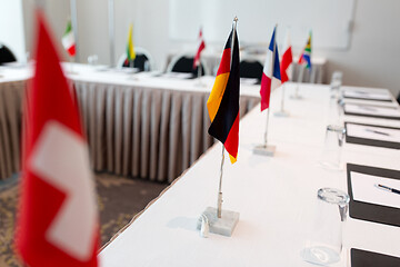 Image showing flags at international conference boardroom