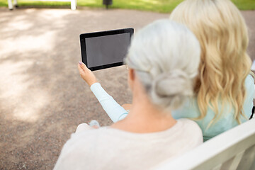 Image showing adult daughter and senior mother with tablet pc