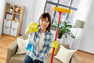 Image showing asian woman with window cleaner and sponge mop