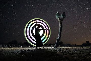 Image showing Person Light Painted in the Desert Under the Night Sky