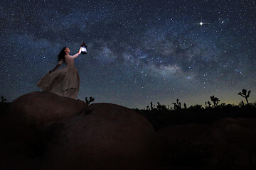 Image showing Girl Holding Lantern in the Desert Under the Milky Way