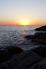 Image showing Sunset on the rocky shore. Tyrrhenian Sea.