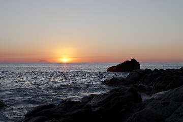 Image showing Sunset on the rocky shore. Tyrrhenian Sea.