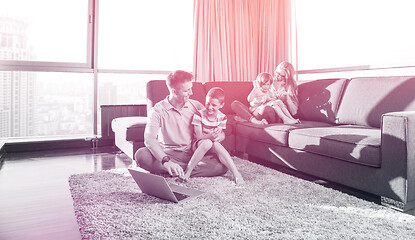 Image showing Happy family playing a video game