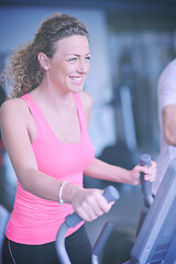 Image showing woman exercising on treadmill in gym