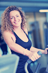 Image showing woman exercising on treadmill in gym