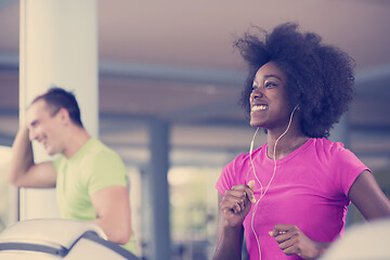 Image showing people exercisinng a cardio on treadmill