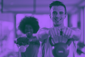 Image showing couple  workout with weights at  crossfit gym