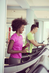 Image showing people exercisinng a cardio on treadmill in gym