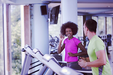 Image showing people exercisinng a cardio on treadmill