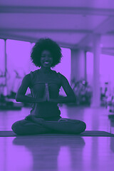 Image showing african american woman exercise yoga in gym