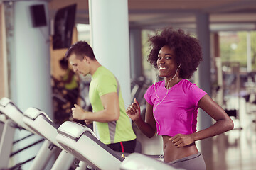 Image showing people exercisinng a cardio on treadmill