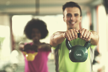 Image showing couple  workout with weights at  crossfit gym