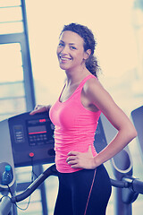 Image showing woman exercising on treadmill in gym