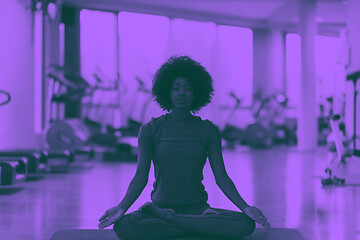 Image showing african american woman exercise yoga in gym