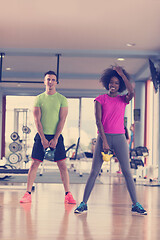 Image showing couple  workout with weights at  crossfit gym