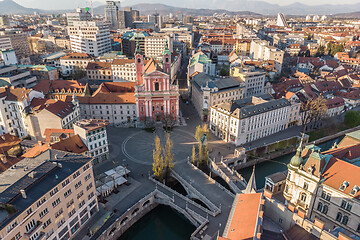 Image showing Aerial drone view of Preseren Squere and Triple Bridge over Ljubljanica river,Tromostovje, Ljubljana, Slovenia. Empty streets during corona virus pandemic social distancing measures